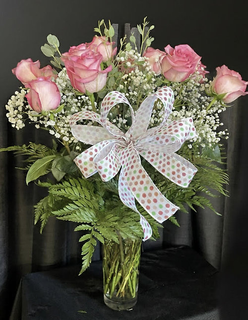 One Dozen Pink Roses with Greenery in a Vase